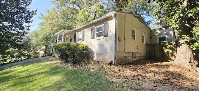 view of home's exterior featuring a lawn