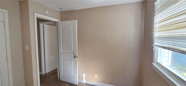 unfurnished bedroom featuring hardwood / wood-style flooring