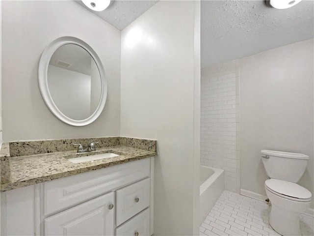 full bath with vanity, a textured ceiling, toilet, and tile patterned floors