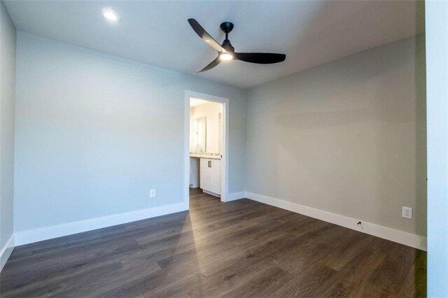 unfurnished bedroom featuring dark hardwood / wood-style flooring and ceiling fan