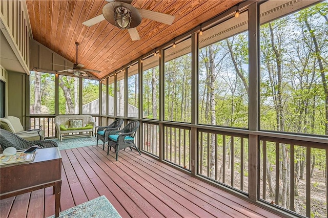 sunroom / solarium with plenty of natural light, ceiling fan, and an outdoor living space