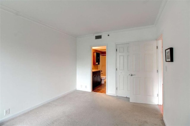 3481 Lakeside Dr NE Unit 902, Atlanta, GA 30326 - unfurnished bedroom featuring crown molding, carpet floors, and ensuite bath