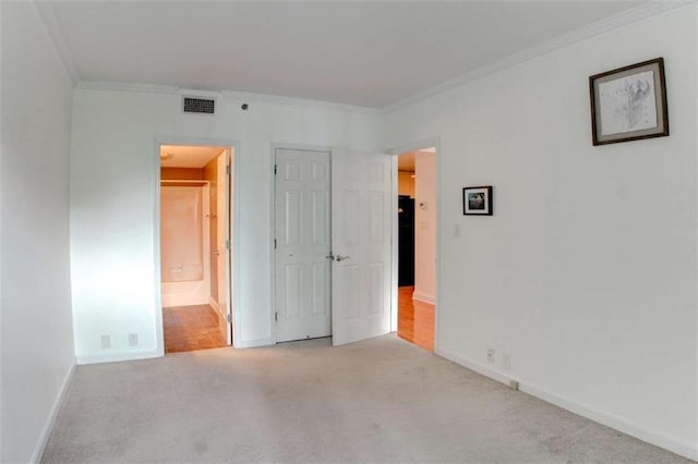 3481 Lakeside Dr NE Unit 902, Atlanta, GA 30326 - unfurnished bedroom with crown molding, carpet flooring, connected bathroom, and a closet