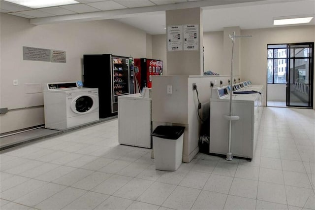 3481 Lakeside Dr NE Unit 902, Atlanta, GA 30326 - kitchen featuring washing machine and dryer and light countertops