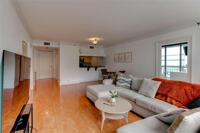 3481 Lakeside Dr NE Unit 902, Atlanta, GA 30326 - living area with crown molding and light wood-style flooring