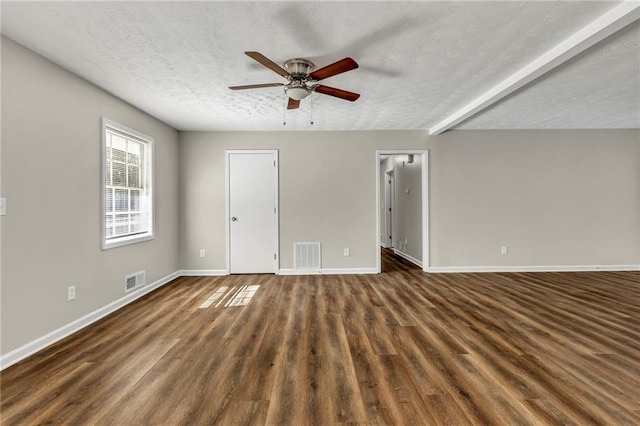 interior space with dark hardwood / wood-style flooring, ceiling fan, and a textured ceiling