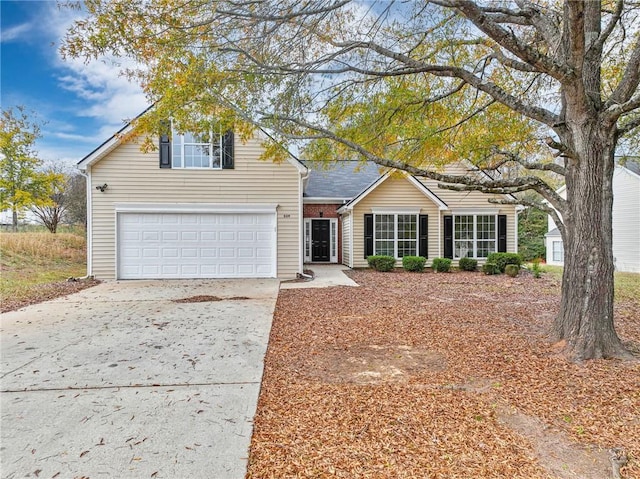 traditional-style house with concrete driveway