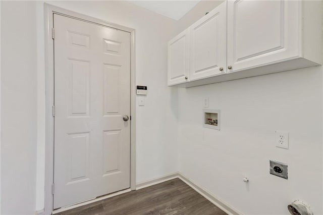 laundry area featuring hookup for a washing machine, hookup for an electric dryer, baseboards, cabinet space, and dark wood finished floors