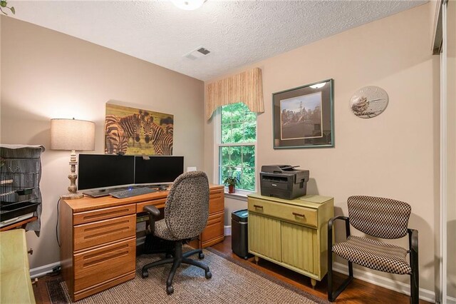 624 Spanish Oak Dr, Acworth, GA 30102 - home office featuring dark wood finished floors, a textured ceiling, and baseboards