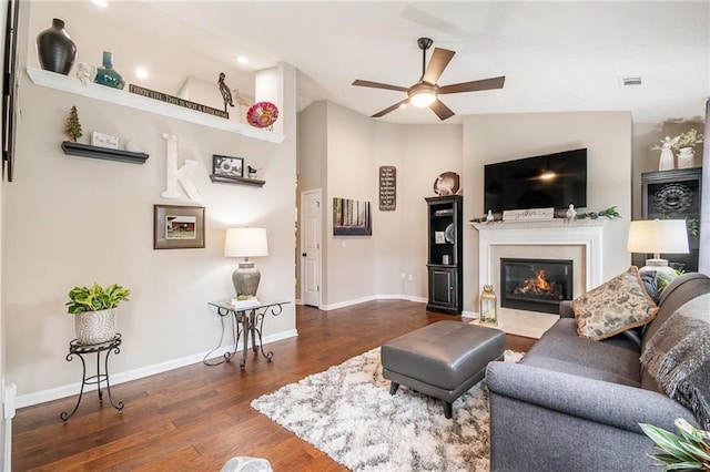 624 Spanish Oak Dr, Acworth, GA 30102 - living area with a ceiling fan, wood finished floors, a glass covered fireplace, baseboards, and vaulted ceiling