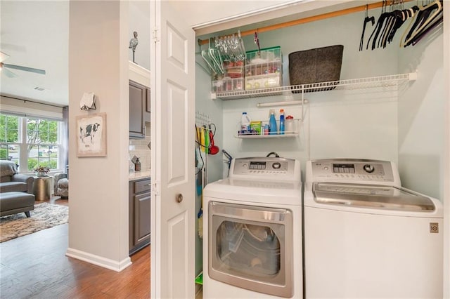 624 Spanish Oak Dr, Acworth, GA 30102 - clothes washing area featuring washer and clothes dryer, wood finished floors, a ceiling fan, and baseboards
