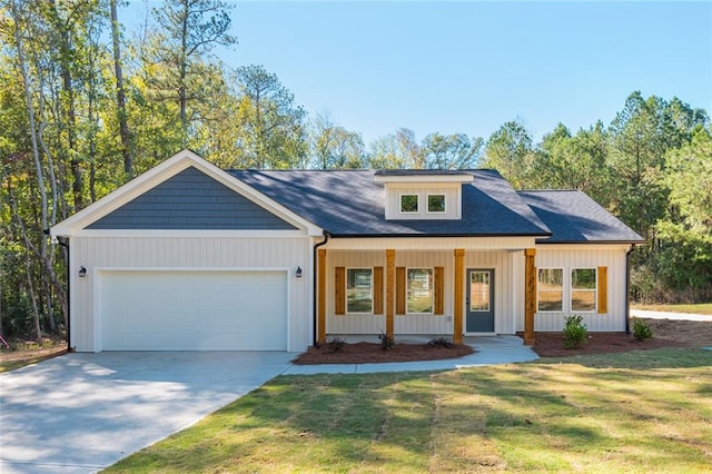 262 Stephens Rd, Cedartown, GA 30125 - view of front of property featuring an attached garage, a porch, concrete driveway, and a front yard