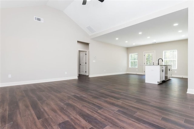 262 Stephens Rd, Cedartown, GA 30125 - unfurnished living room featuring ceiling fan, dark wood-style flooring, baseboards, recessed lighting, and high vaulted ceiling