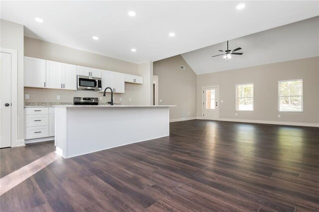 262 Stephens Rd, Cedartown, GA 30125 - kitchen featuring appliances with stainless steel finishes, a center island with sink, white cabinets, a ceiling fan, and open floor plan