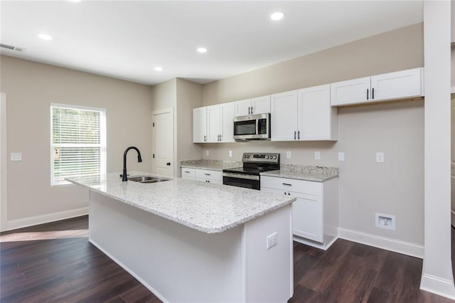 262 Stephens Rd, Cedartown, GA 30125 - kitchen with appliances with stainless steel finishes, white cabinets, an island with sink, dark wood finished floors, and recessed lighting