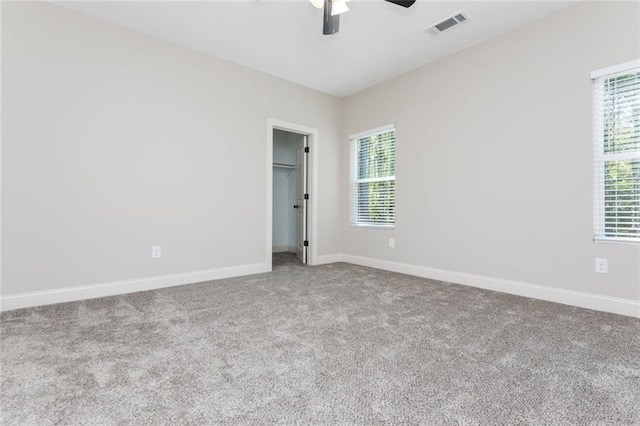 262 Stephens Rd, Cedartown, GA 30125 - unfurnished bedroom with carpet floors, baseboards, a walk in closet, and ceiling fan