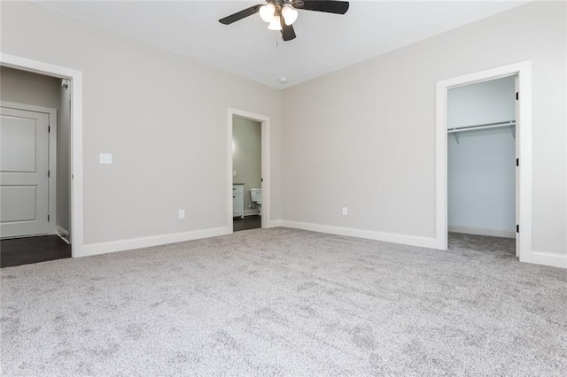 262 Stephens Rd, Cedartown, GA 30125 - unfurnished bedroom featuring dark colored carpet, baseboards, and ensuite bath