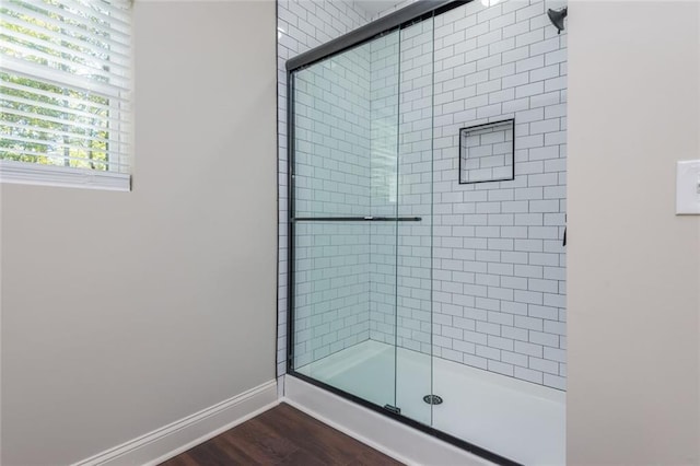 262 Stephens Rd, Cedartown, GA 30125 - bathroom featuring a stall shower, wood finished floors, and baseboards