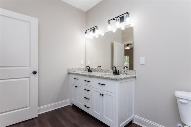 262 Stephens Rd, Cedartown, GA 30125 - bathroom featuring double vanity, wood finished floors, and ceiling fan