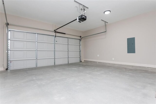 262 Stephens Rd, Cedartown, GA 30125 - garage featuring electric panel, a garage door opener, and baseboards