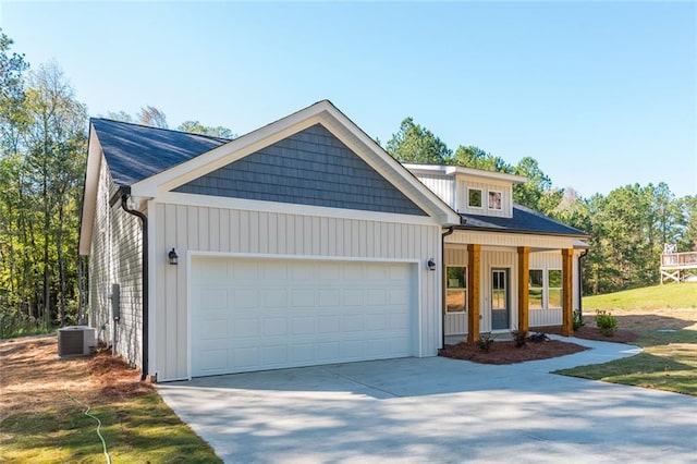 262 Stephens Rd, Cedartown, GA 30125 - view of front of property featuring a garage, concrete driveway, central AC, and covered porch