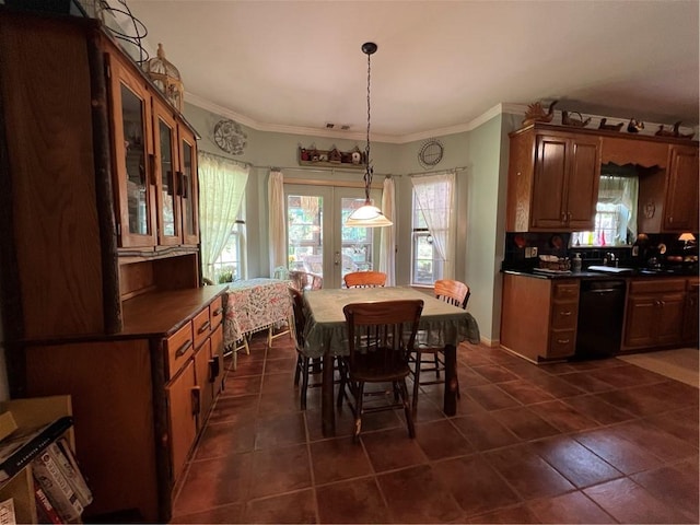 kitchen featuring dishwasher, dark countertops, plenty of natural light, and ornamental molding