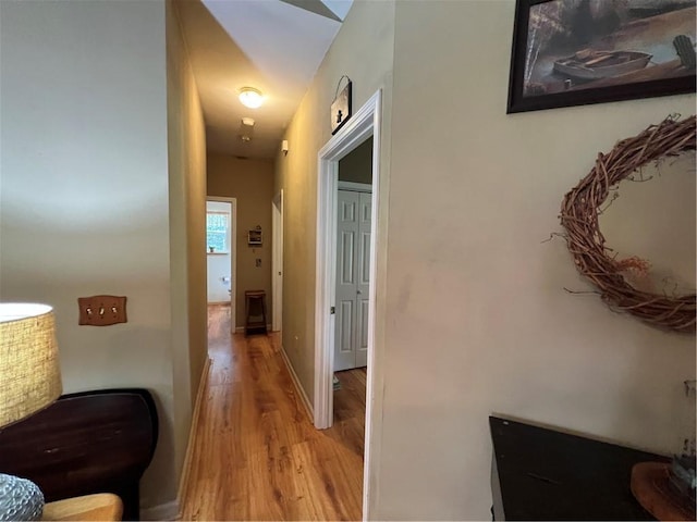 hallway with light wood-style floors