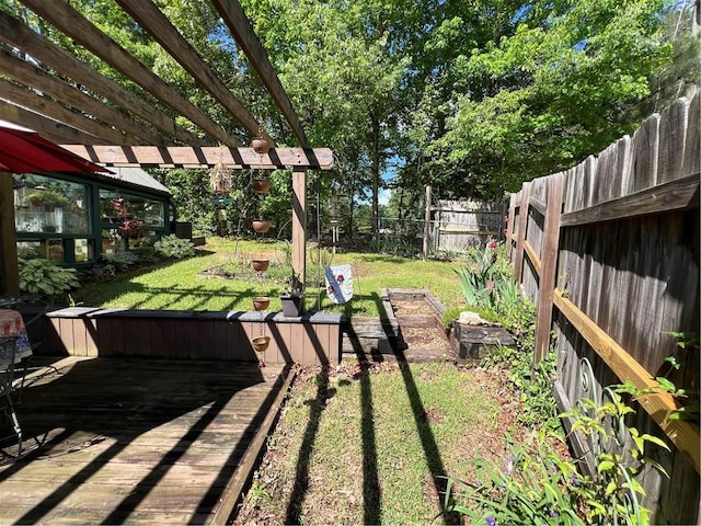 view of yard with a deck and a pergola
