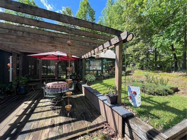 wooden terrace with a pergola, outdoor dining space, and a lawn