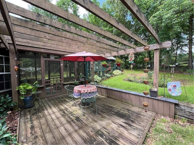 wooden terrace with a pergola and a lawn