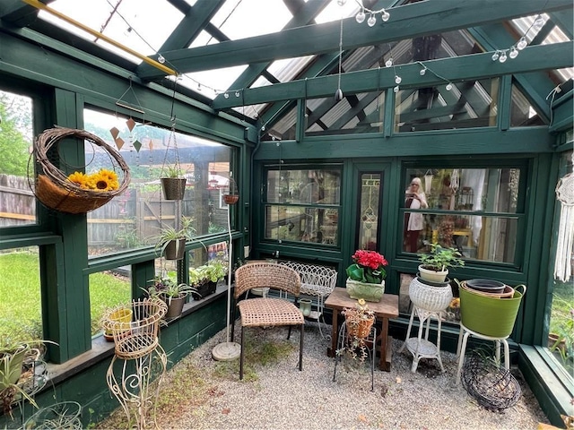 sunroom / solarium with vaulted ceiling