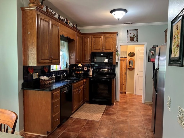 kitchen featuring black appliances, tasteful backsplash, a sink, dark countertops, and ornamental molding
