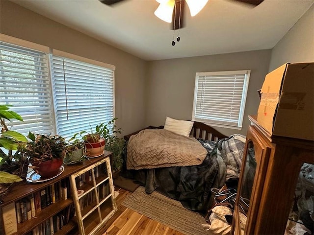 bedroom featuring ceiling fan and wood finished floors