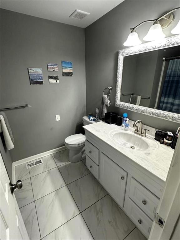 bathroom with toilet, marble finish floor, visible vents, and vanity