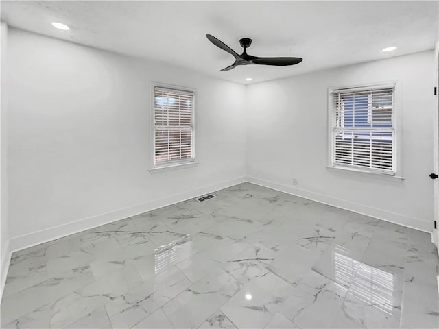 spare room featuring ceiling fan