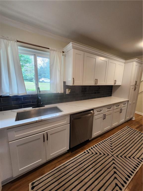 kitchen featuring sink, white cabinets, and stainless steel dishwasher