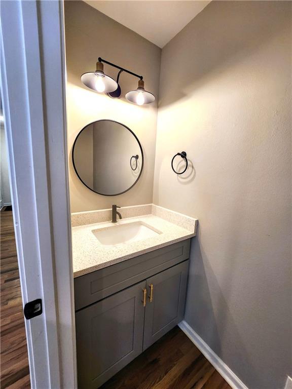 bathroom featuring vanity and hardwood / wood-style floors