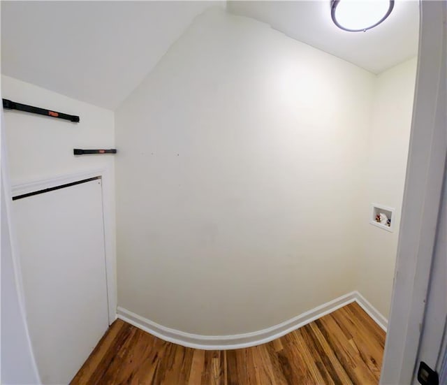 interior space featuring hardwood / wood-style floors and lofted ceiling