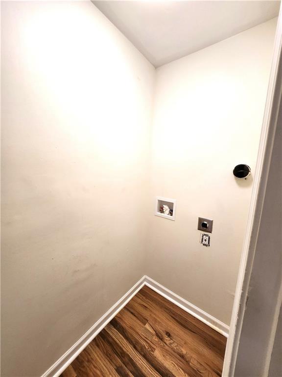 laundry area featuring hookup for a washing machine and hardwood / wood-style floors