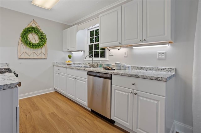 kitchen featuring stainless steel dishwasher, light wood-type flooring, a sink, baseboards, and white cabinetry