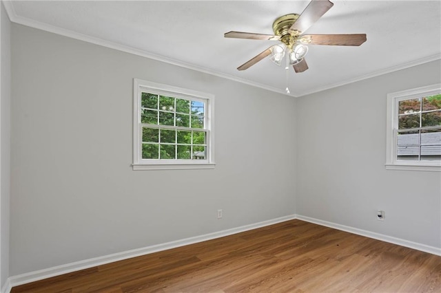 unfurnished room featuring a ceiling fan, baseboards, ornamental molding, and wood finished floors