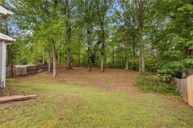 view of yard with a fenced backyard