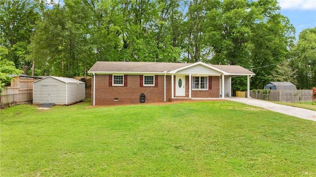 single story home with fence, a storage shed, a front yard, and concrete driveway