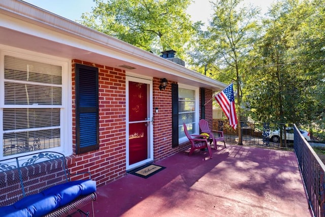 entrance to property with brick siding