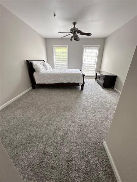 unfurnished bedroom with carpet floors and ceiling fan