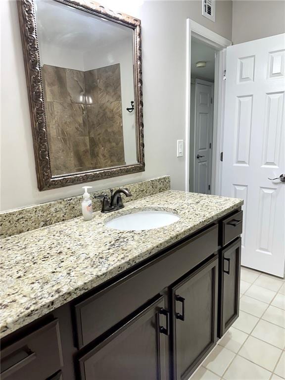 bathroom with vanity and tile patterned flooring