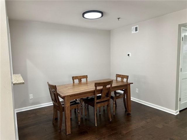 dining room featuring dark hardwood / wood-style floors