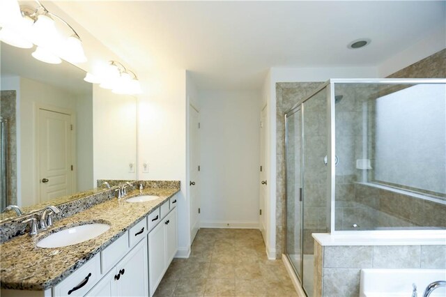 bathroom featuring separate shower and tub, tile patterned floors, and vanity