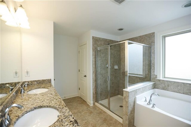 bathroom with vanity, tile patterned floors, and independent shower and bath