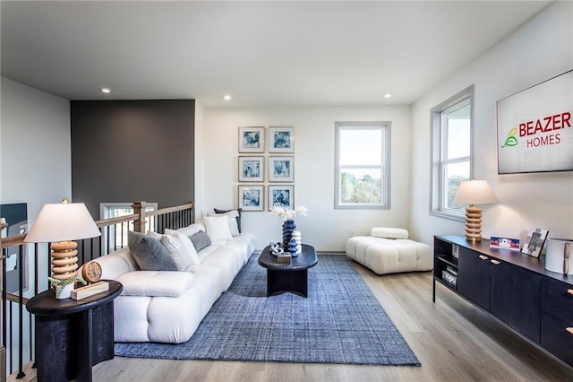 living area featuring recessed lighting and light wood-style flooring